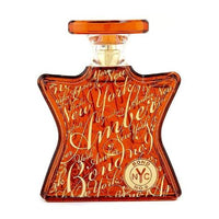 Bond No. 9 Amber perfume bottle with ornate orange label and stopper