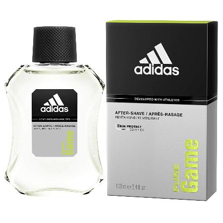 Adidas Pure Game aftershave bottle with black cap next to product box with white and lime green labeling