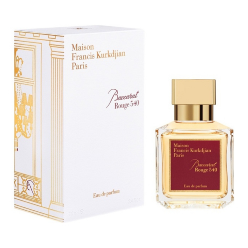 Baccarat Rouge 540 perfume bottle with gold cap next to white branded box with gold accents