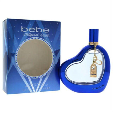 Bebe Hollywood Jetset Eau De Parfum bottle in blue with gold charm next to packaging box
