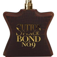 Bond No. 9 Sutton Place dark brown bottle with gold text and gold spray atomizer