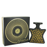 Bond No. 9 Wall Street black box with gold circular design and matching black fragrance bottle with gold pattern.
