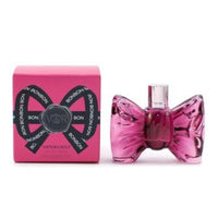 Bonbon Eau De Parfum bottle in pink with matching bow-shaped box featuring black ribbon design