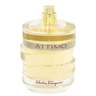 Attimo Eau De Parfum bottle, pale yellow fragrance in clear glass with gold band and spray atomizer.