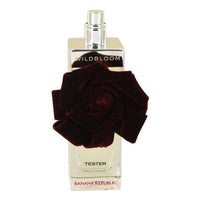 Banana Republic Wildbloom Rouge perfume bottle with dark red rose and cream-colored label