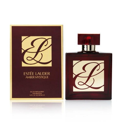 Amber Mystique perfume bottle in deep burgundy with cream label next to matching box packaging